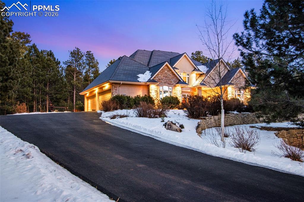 Image 2 of 42: Driveway up to 4-car garage
