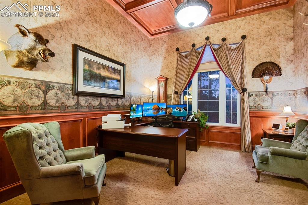 Image 20 of 42: Office with coffered ceilings located on the main level