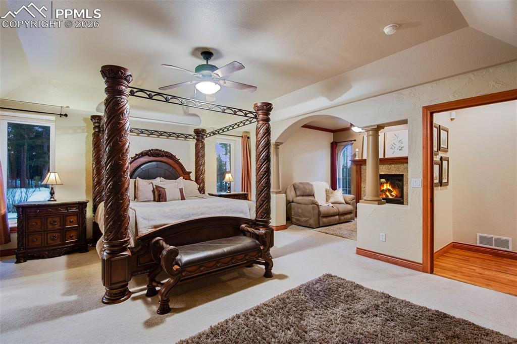 Image 21 of 42: Primary suite located on the main level with sitting area which includes a 