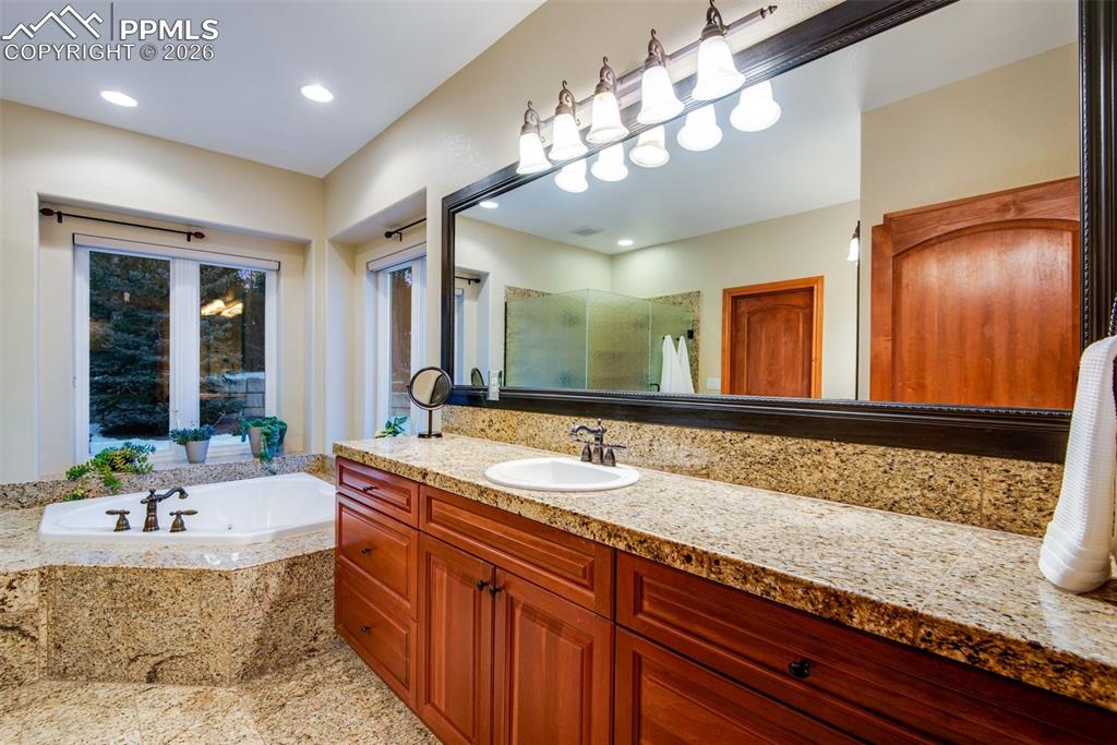 Image 22 of 42: One of two vanity areas in the primary bathroom
