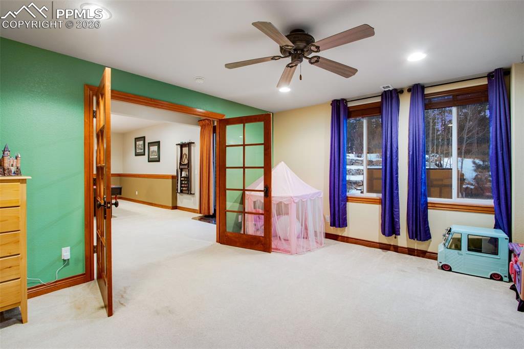 Image 31 of 42: Bonus room located in the basement level which can be used as a play room o