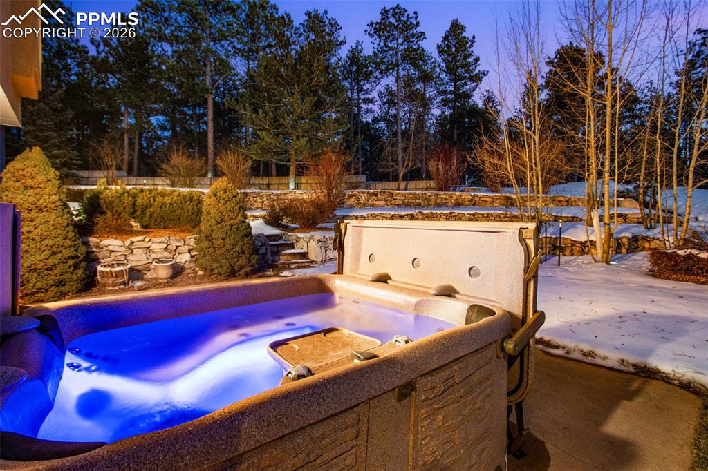 Image 35 of 42: Hot tub located on the patio of the walkout basement
