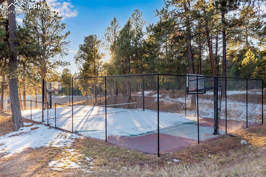 Image 39 of 42: Community basketball/tennis/pickleball courts located next to the club hous