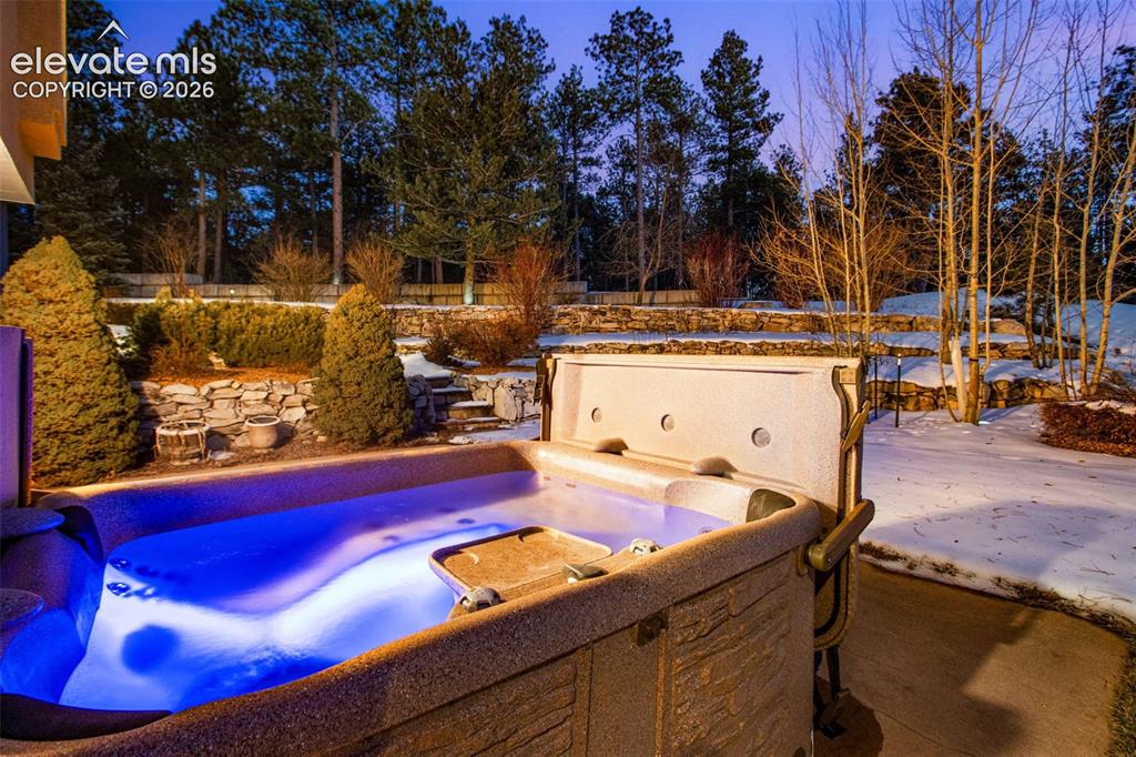 Image 44 of 49: Hot tub located on the patio of the walkout basement