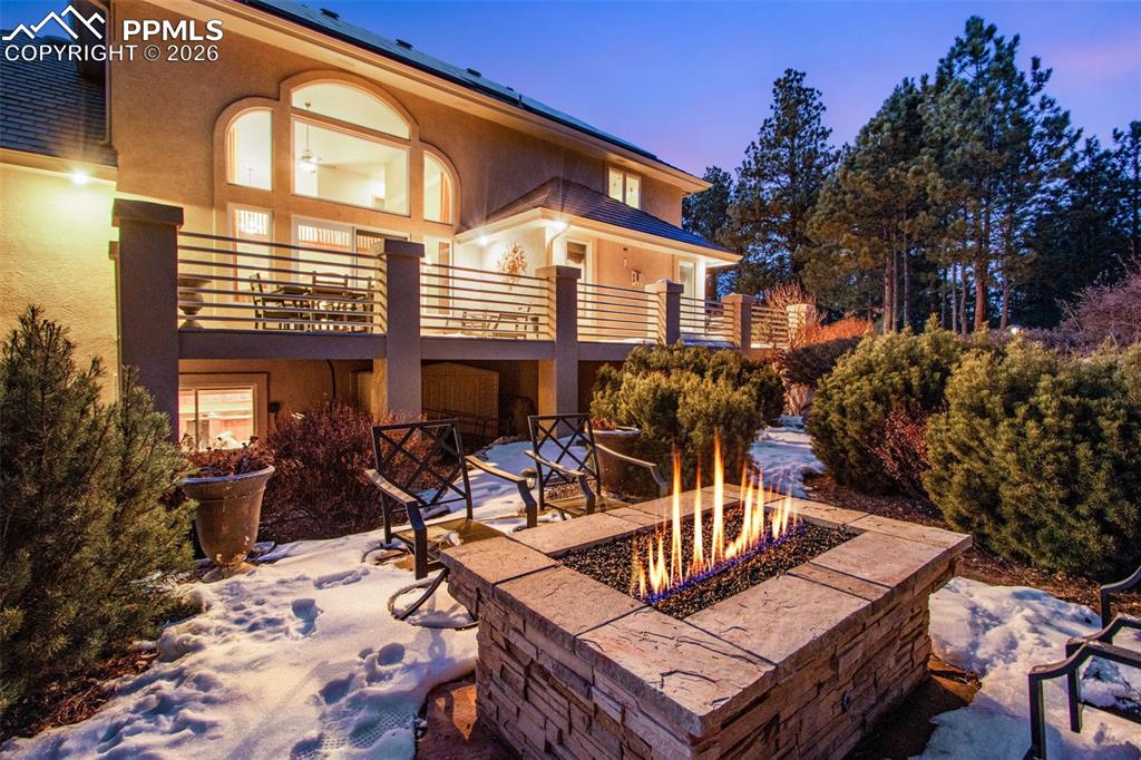 Image 7 of 42: View from the gas fire pit in the back yard looking east towards the house