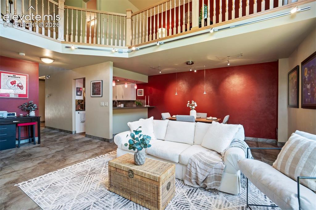 Image 10 of 50: The main living area flows easily into the dining room & kitchen, making th