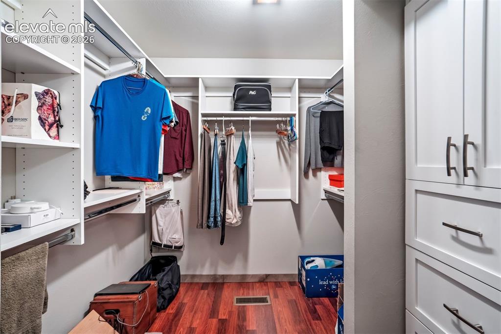 Image 28 of 50: Updated primary walk-in closet