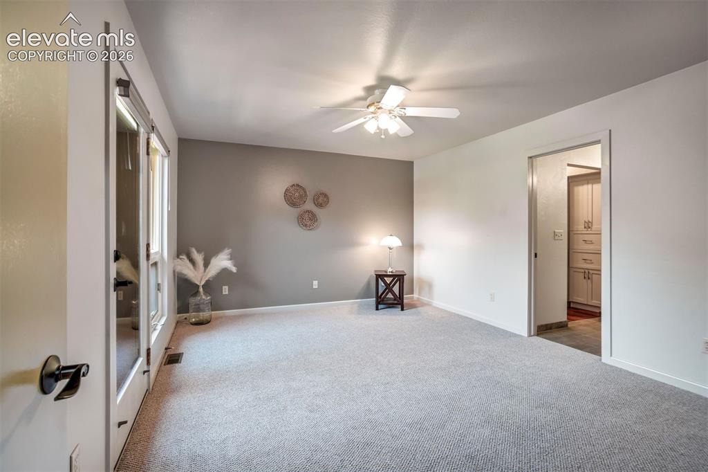 Image 35 of 50: upper-level junior primary suite offers privacy for guests or family.