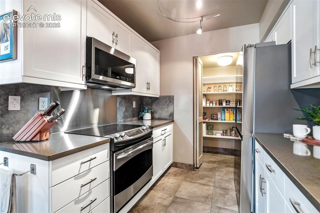 Image 4 of 50: Completly updated kitchen to include stainless steel appliances, quartz cou