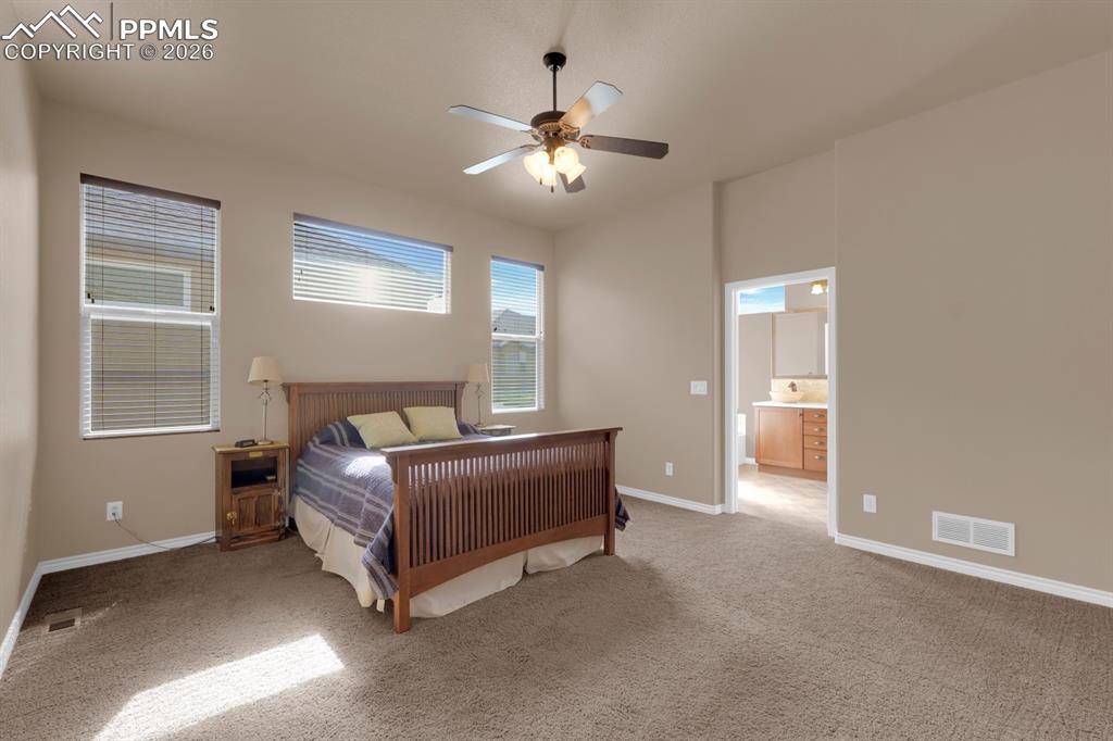 Image 13 of 33: Primary bedroom with attached 5pc bathroom