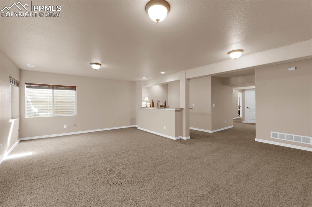 Image 21 of 33: Spacious lower level family room