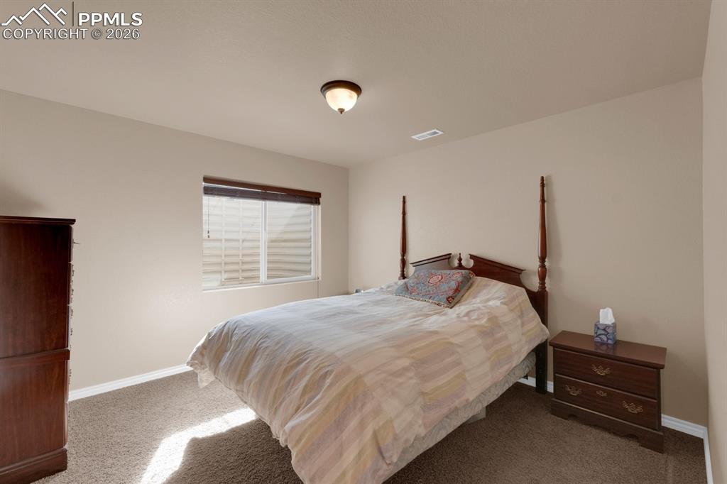 Image 24 of 33: Basement bedroom