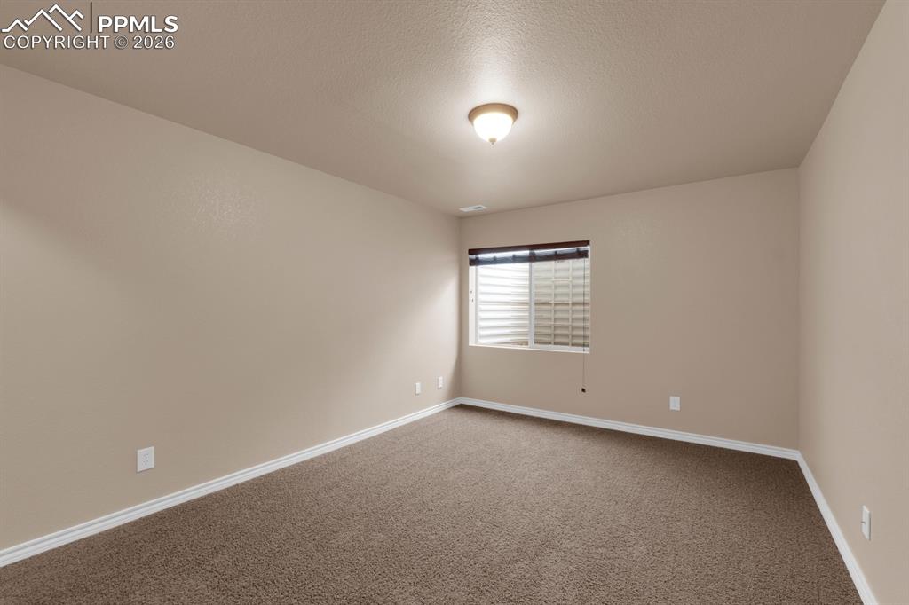 Image 25 of 33: Basement bedroom