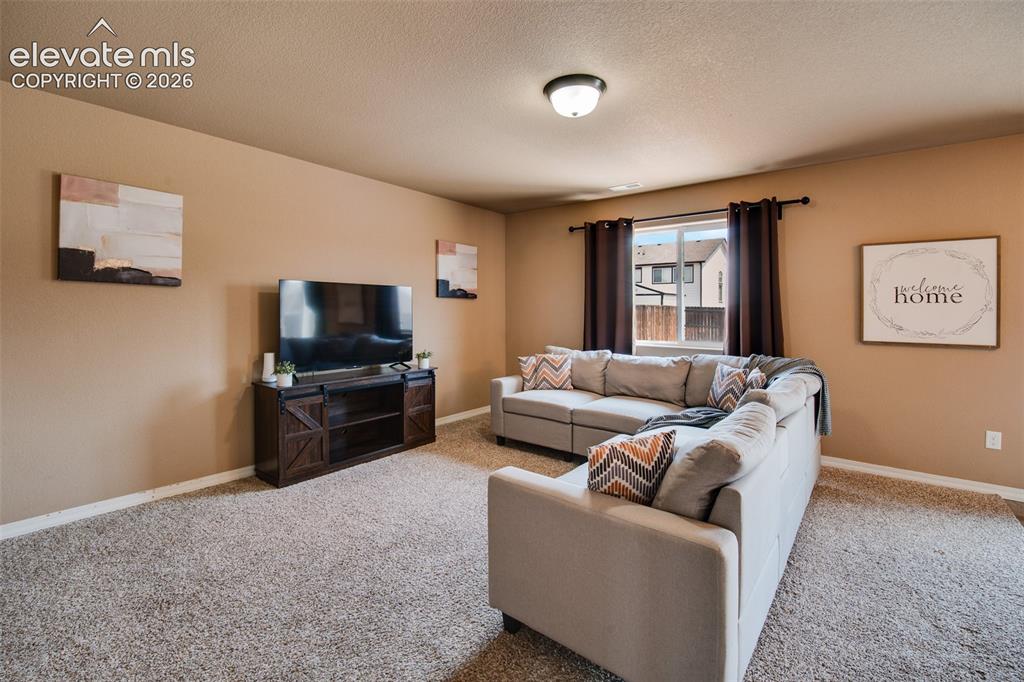 Image 10 of 37: The Family Room creates an ideal space for everyday living and entertaining