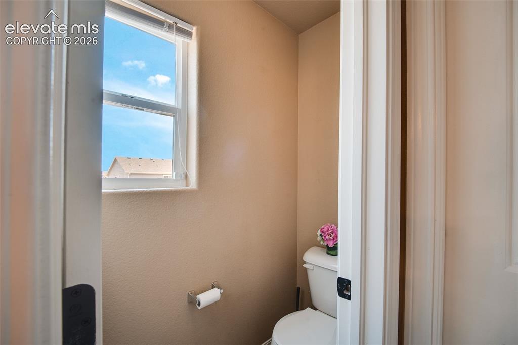 Image 19 of 37: The 5-Piece Primary Bathroom includes a tile floor, dual sink vanity, separ