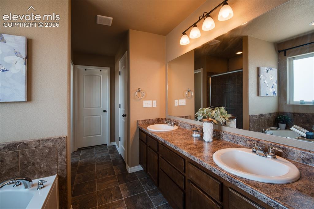 Image 21 of 37: Soaking Tub in the Primary Bathroom.