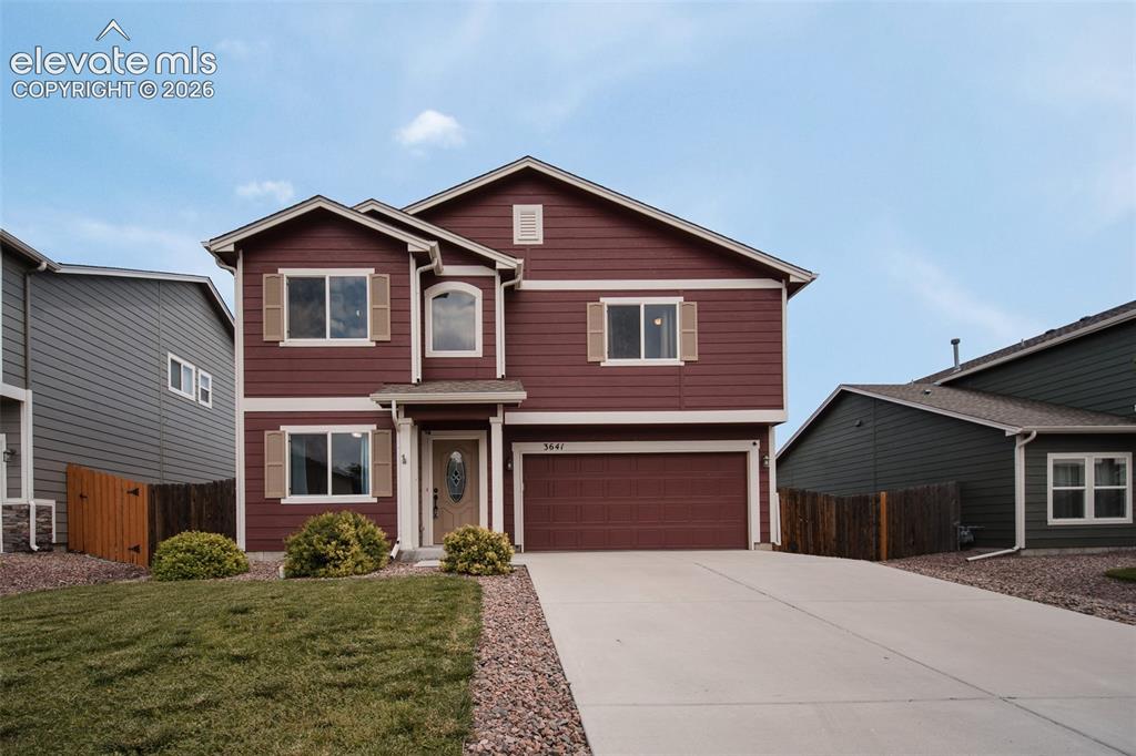 Image 3 of 37: Low maintenance front yard and 2-car attached garage.