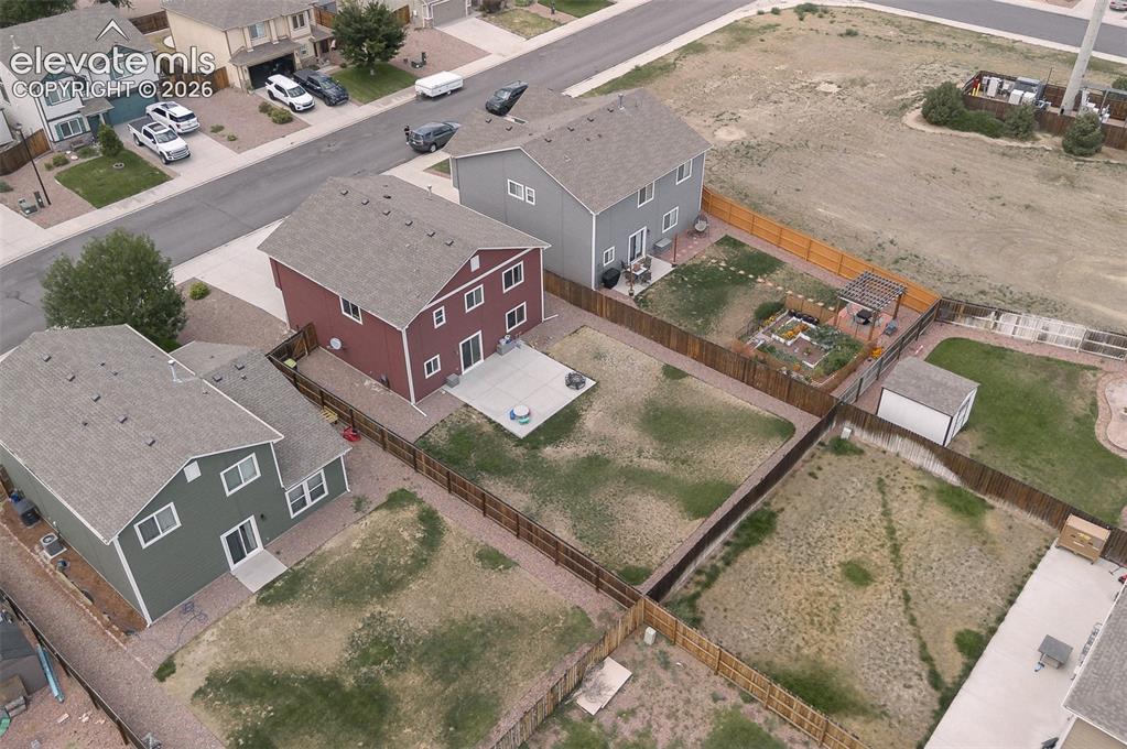 Image 30 of 37: Aerial rear view of home and backyard.