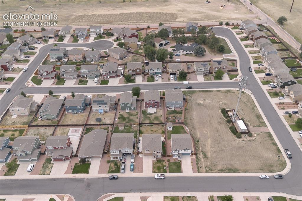 Image 31 of 37: Aerial rear view home, backyard, and neighborhood.