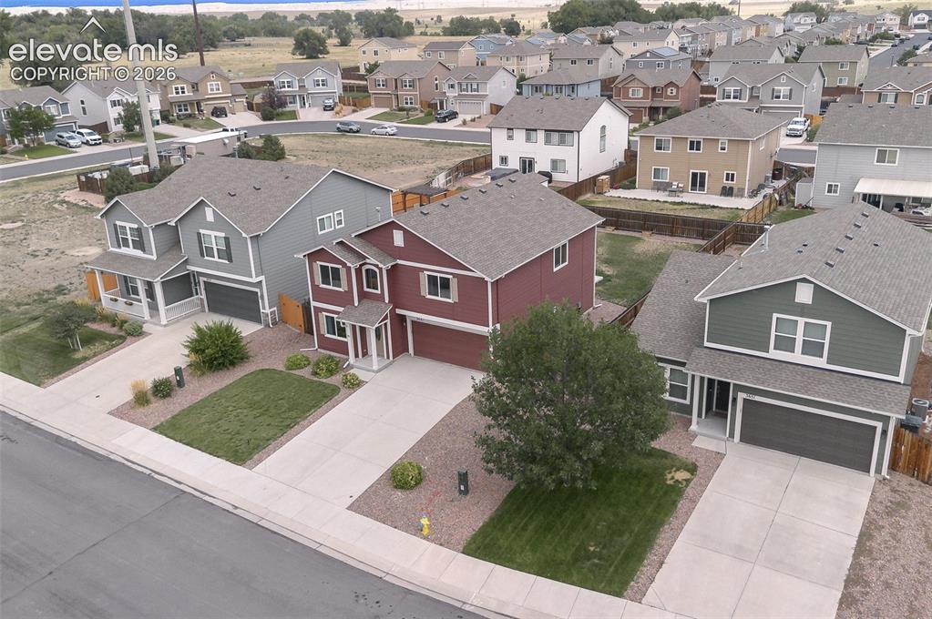 Image 33 of 37: Aerial front view of home.