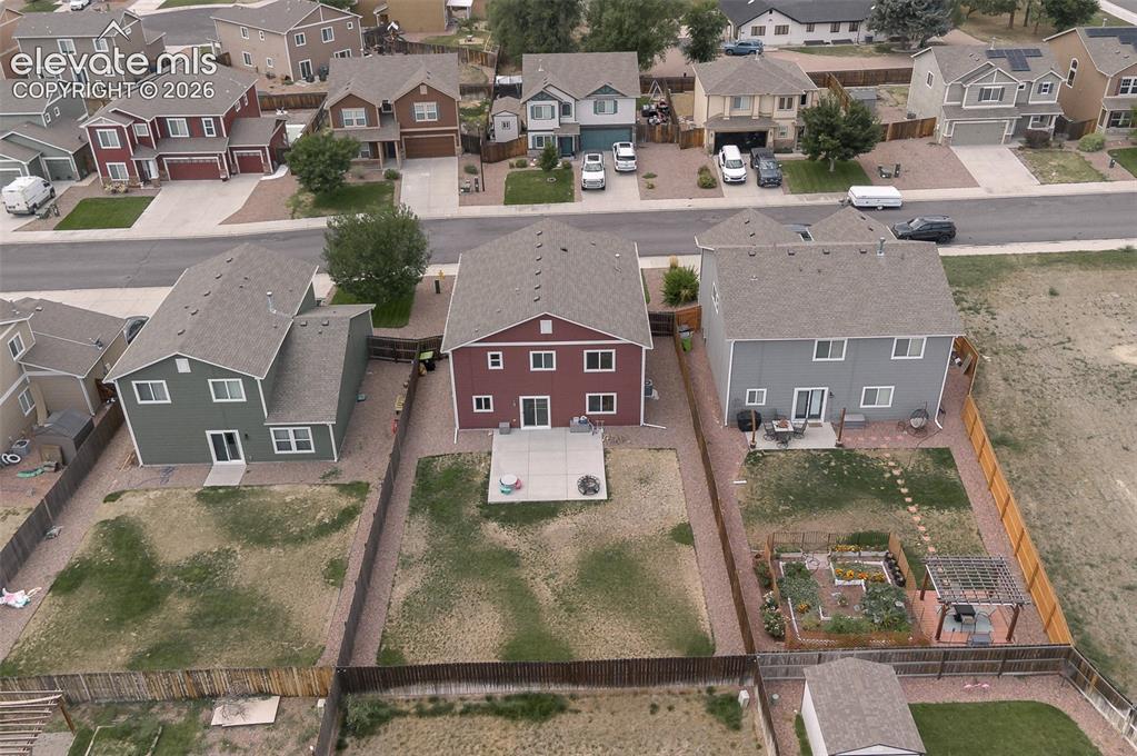 Image 34 of 37: Aerial rear view of home and yard.