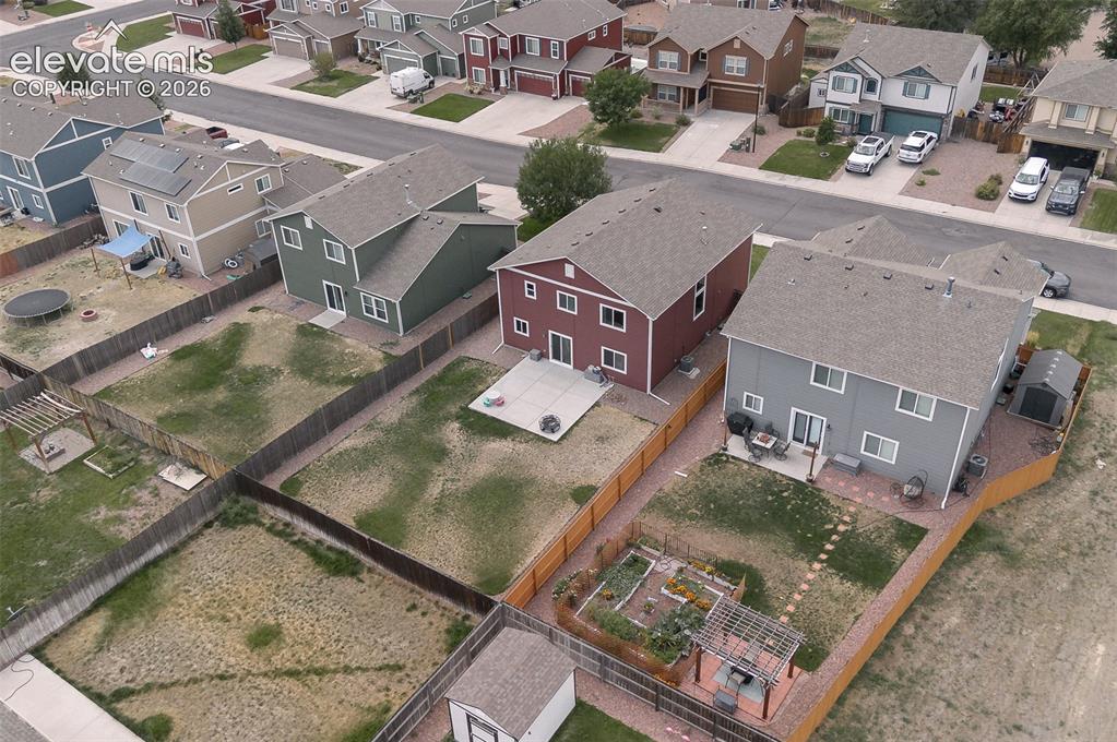 Image 35 of 37: Aerial rear view of home and yard.