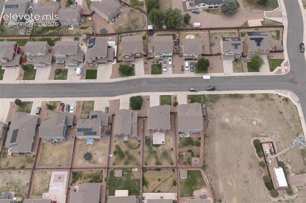 Image 36 of 37: Aerial rear view home, backyard, and neighborhood.