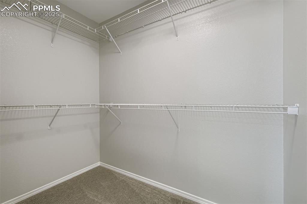 Image 14 of 22: Primary walk-in closet