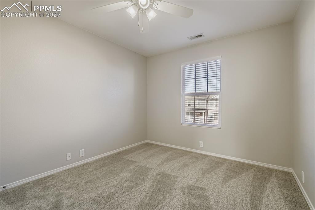 Image 17 of 22: Unfurnished room featuring carpet flooring and ceiling fan