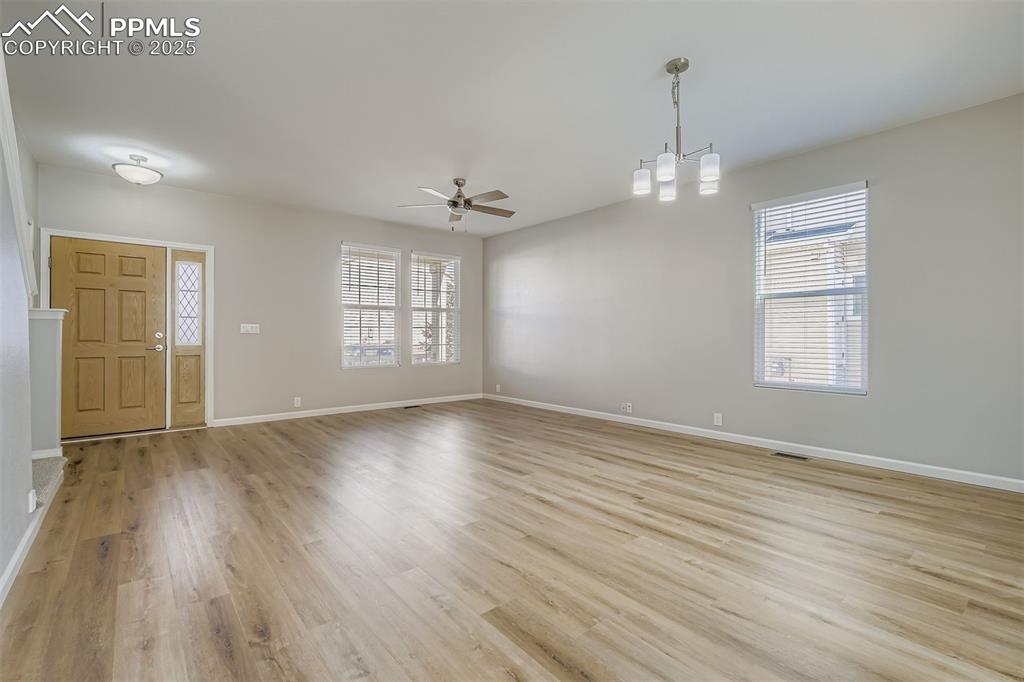 Image 3 of 22: Foyer entrance featuring light wood-type flooring and a ceiling fan