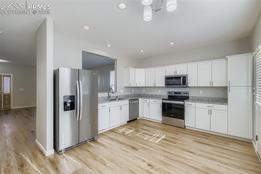 Image 5 of 22: Large kitchen with lots of cabinets and ability to add a eat-in area or mob
