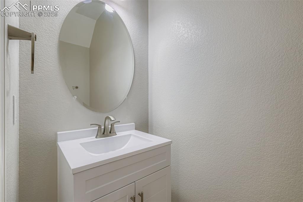 Image 8 of 22: Main level half bath