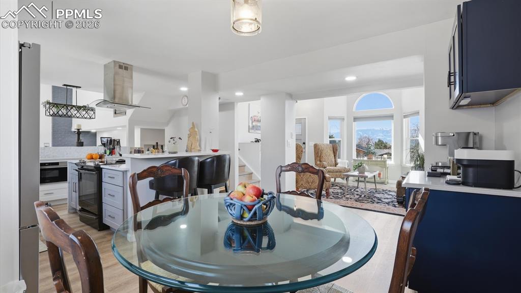 Image 10 of 50: Dining Area located just off the Kitchen with dry bar and beverage refriger