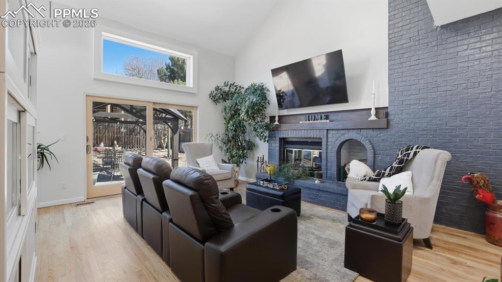 Image 16 of 50: Attractive modern light fixture over the Kitchen and view into the Lower Le