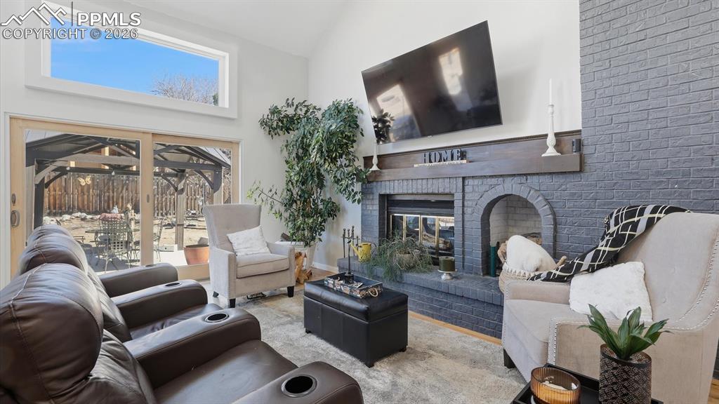 Image 18 of 50: The Lower Level Family Rm invites cozy evenings by the wood-burning firepla