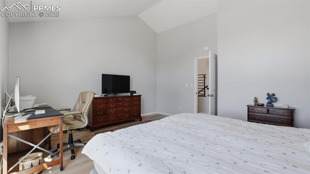 Image 24 of 50: Upper Level Primary Bedroom with walk in closet.