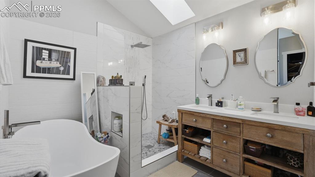 Image 25 of 50: Gorgeous views from the arched window in the Primary Bedroom.