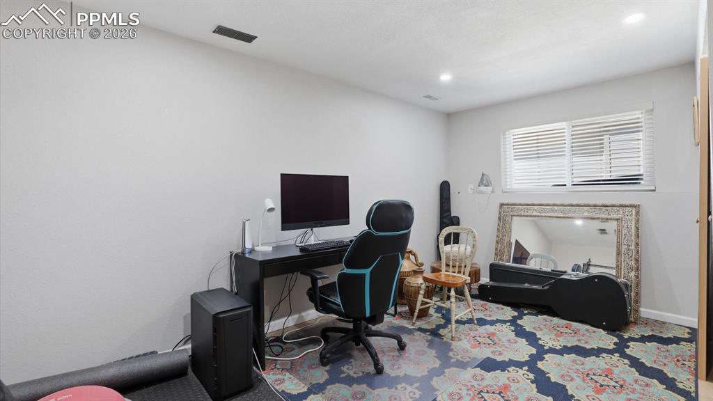 Image 35 of 50: Modern iron rails and upper level hallway.