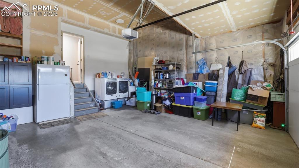 Image 41 of 50: Basement Shower Bathroom with vanity and walk in tiled shower.