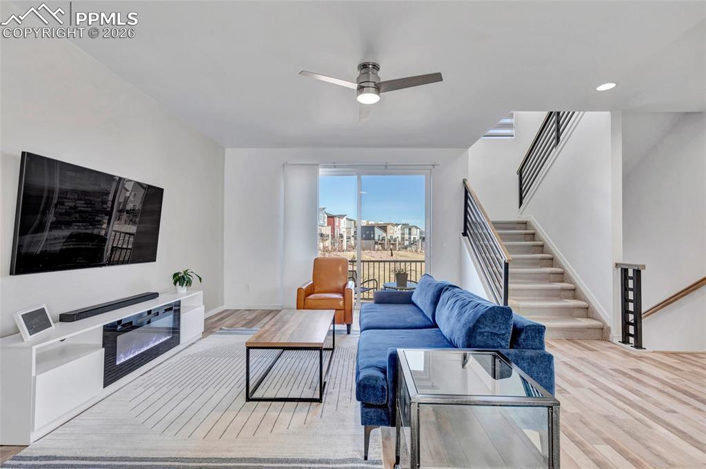 Image 17 of 39: Living room - walkout to deck, recessed lighting, custom wiring for electro
