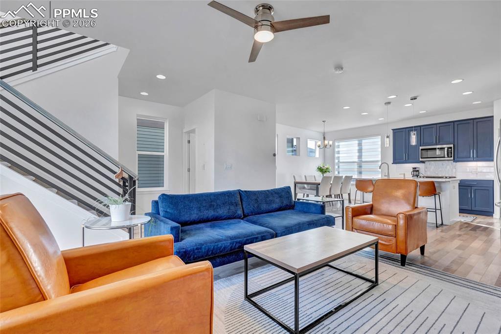 Image 19 of 39: Living room - walkout to deck, recessed lighting, custom wiring for electro