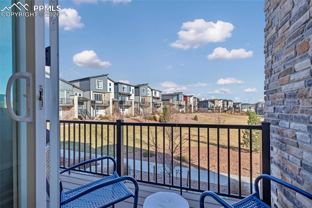 Image 22 of 39: Walkout to deck: built in gas line - never carry propane for the grill agai