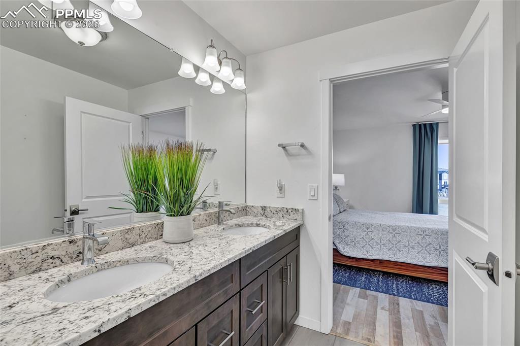 Image 27 of 39: Master bathroom - dual vanity, granite countertops, separate changing area,