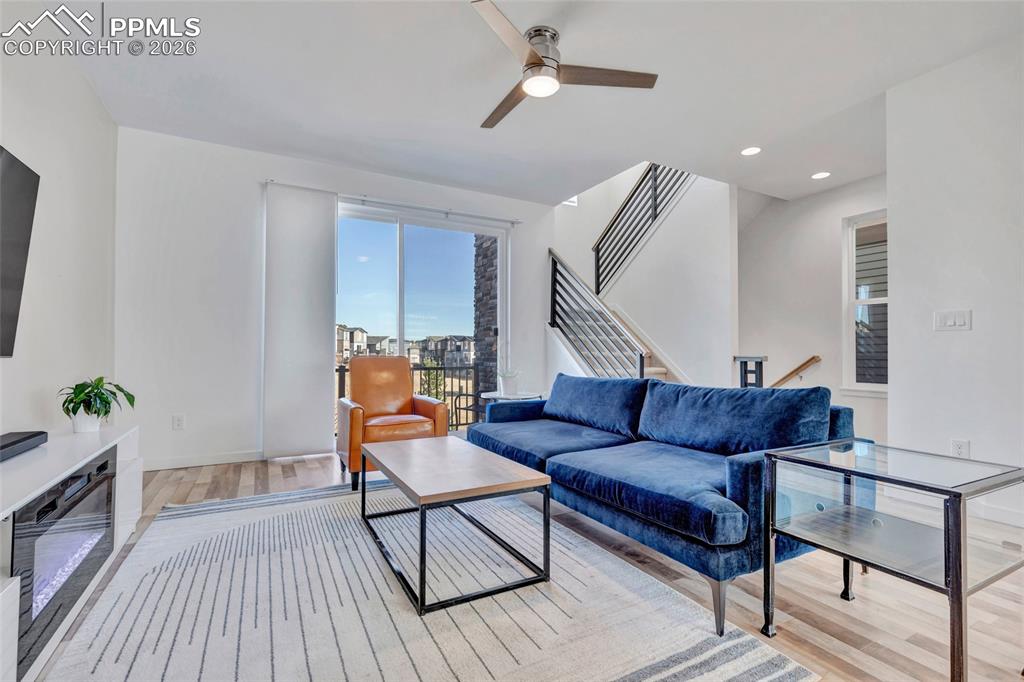 Image 3 of 39: Living room - walkout to deck, recessed lighting, custom wiring for electro