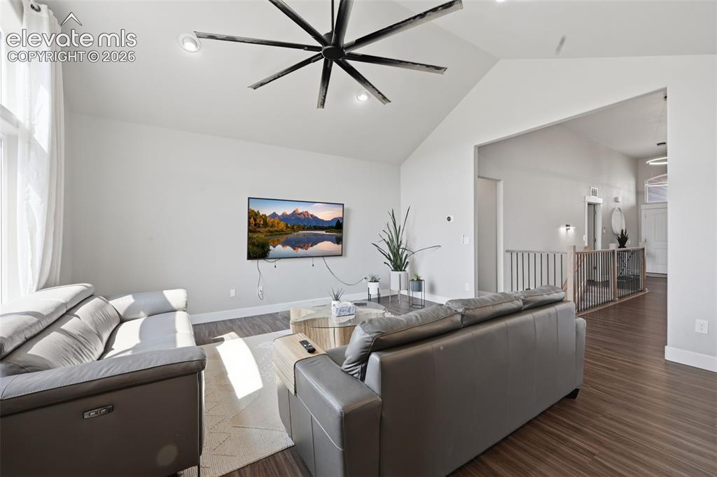Image 12 of 31: The living room flows seamlessly into the kitchen. And, the coffee bar with