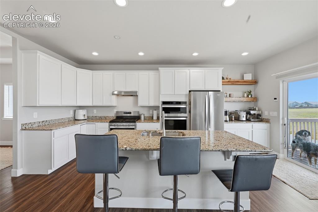Image 15 of 31: The entrance to the dining room is off to the left and a pantry behind the
