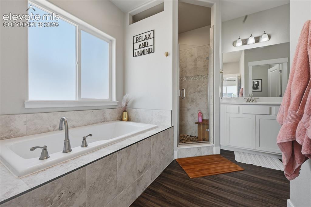 Image 20 of 31: A huge double vanity with lots of light and a large walk in closet will mak