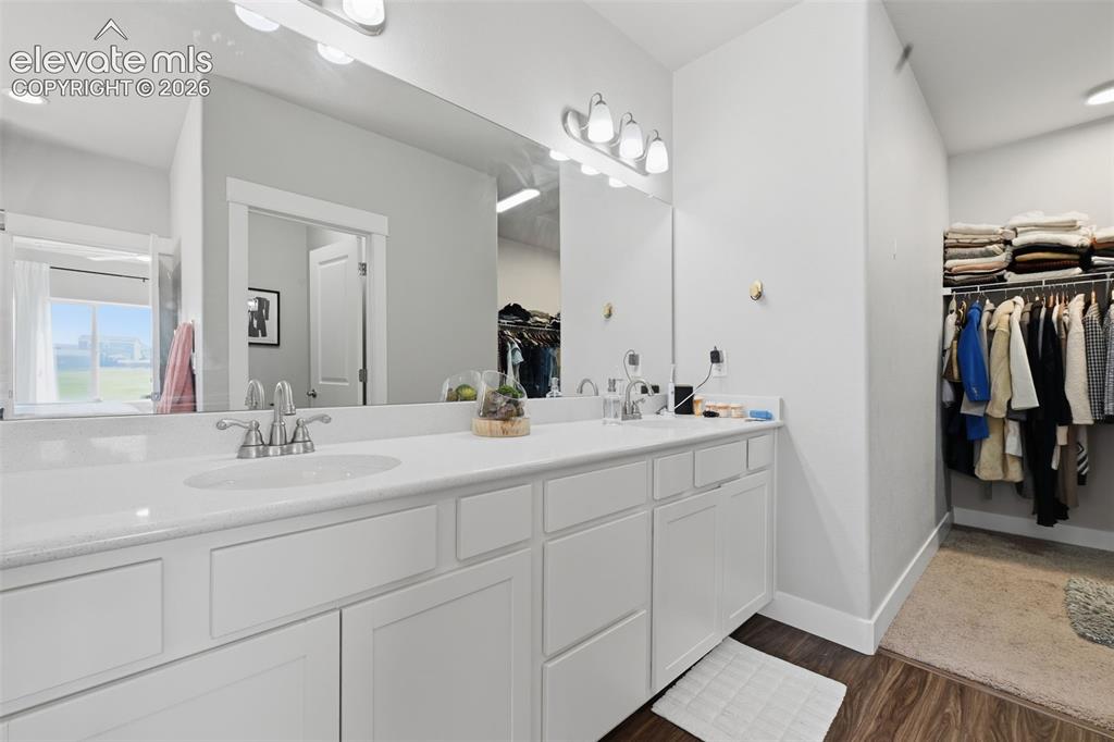 Image 21 of 31: The laundry room is just off the garage. Extra storage cabinets are include