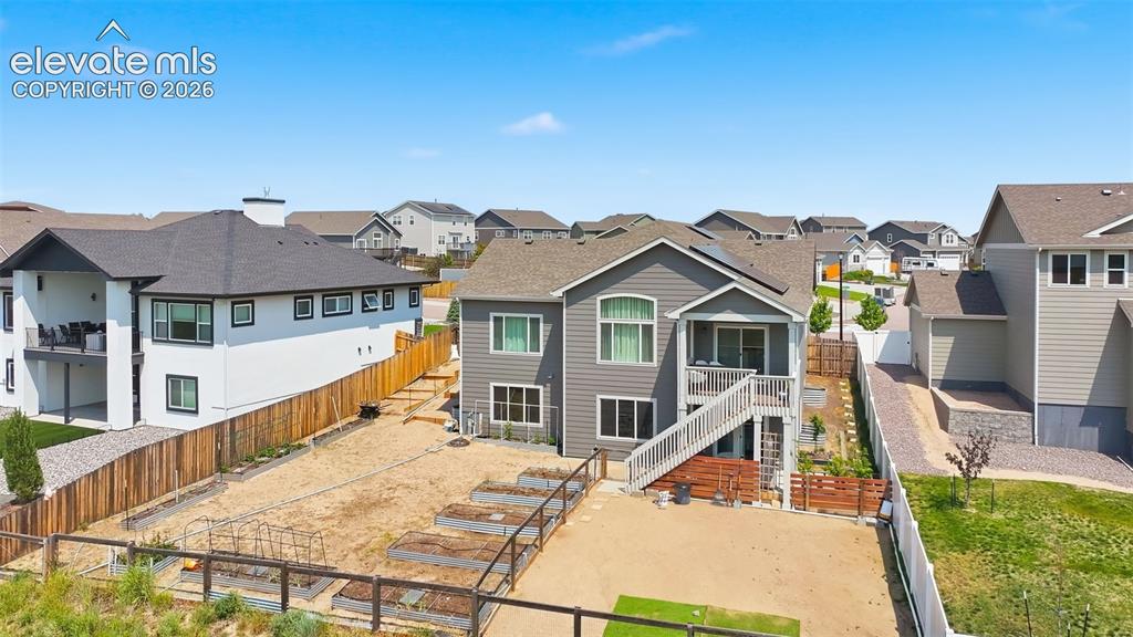 Image 5 of 31: A covered deck to enjoy those beautiful sunsets and the walk out basement c