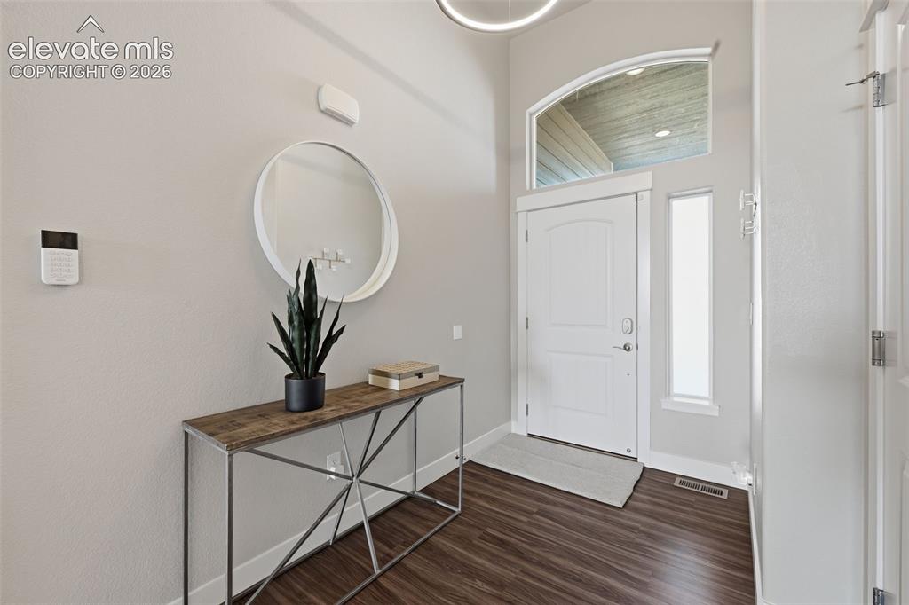 Image 7 of 31: A separate dining room for entertaining or just for hanging out with family